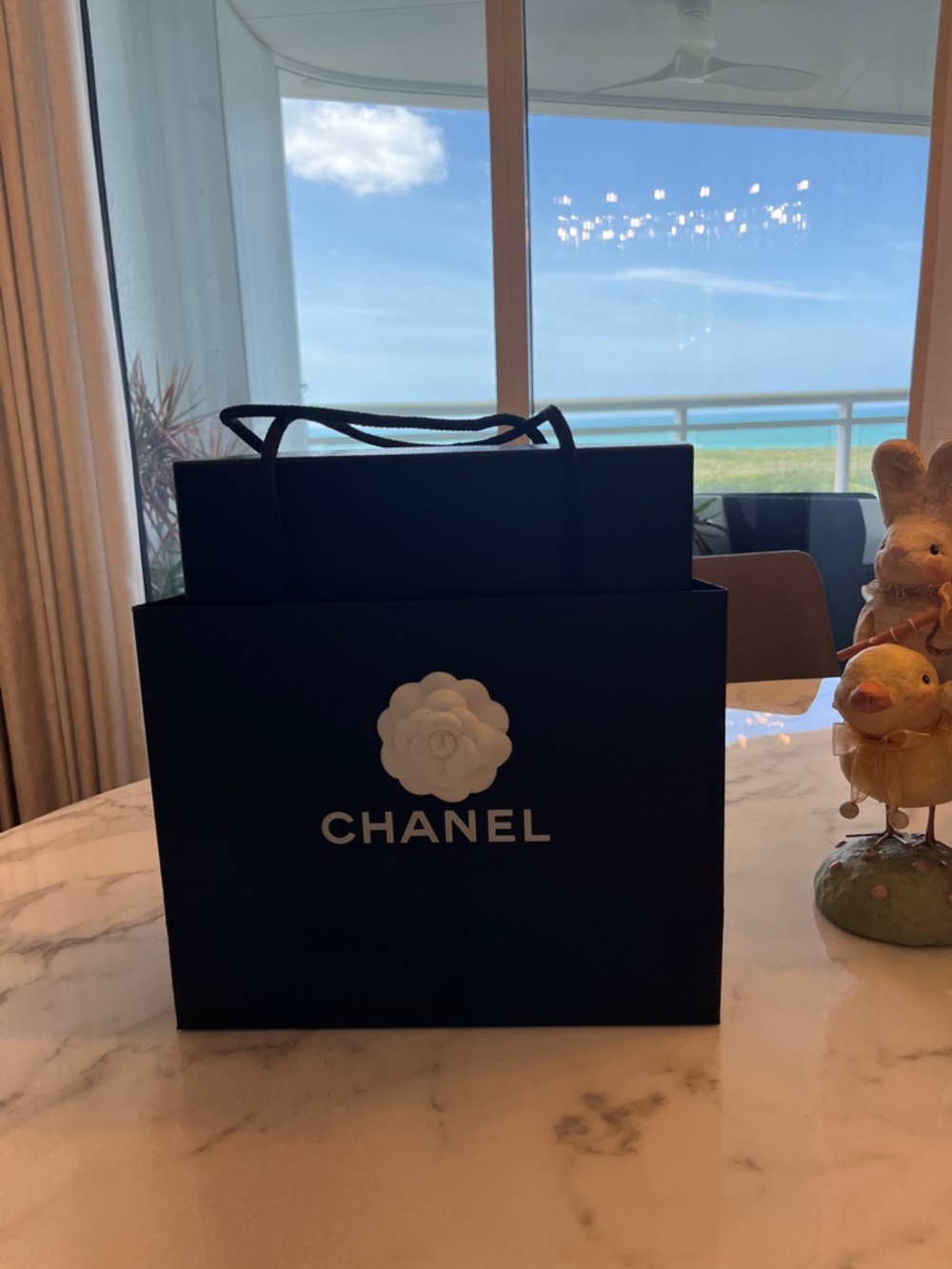 CHANEL Black Shopping Bag with White Camellia Logo and Chanel empty shoe box